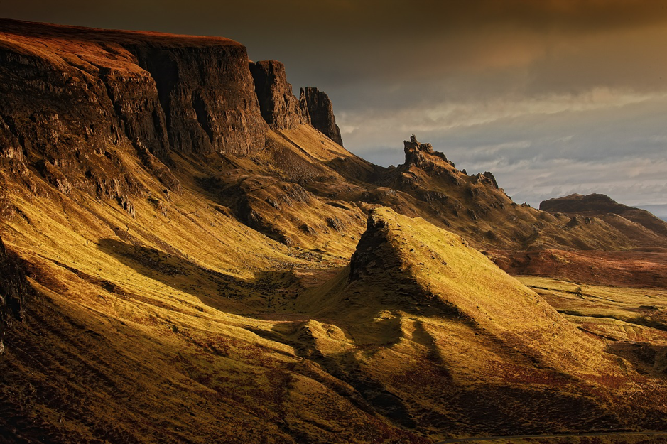 The rugged landscape of the Scottish Highlands bathed in golden light